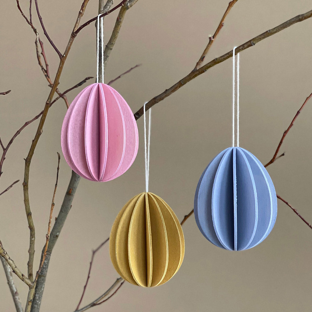 Three wooden Easter eggs by Lovi, size 7cm, colors light pink, honey yellow and flax blue